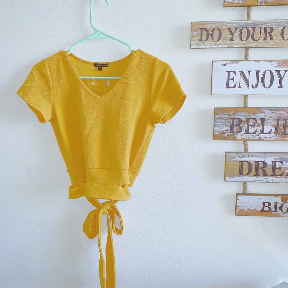 Gold form fit crop top with a cute tie around!